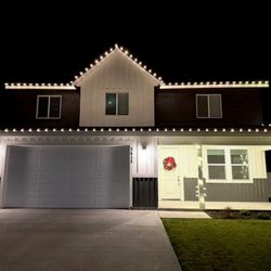 Home Spark  - House with Christmas lights