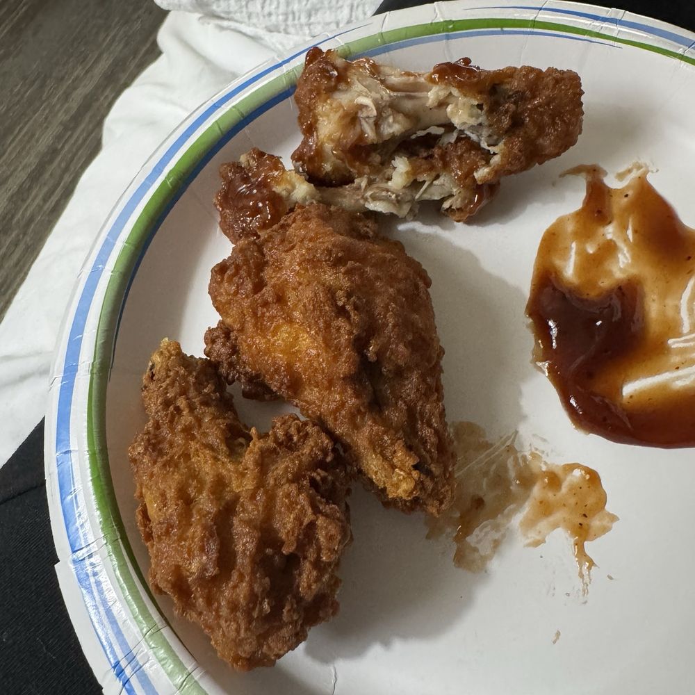 4 wings half gone before I got a picture. lol. They were good and bbq sauce was bomb. 4 wings half gone before I got a picture. lol. They were good and bbq sauce was bomb.