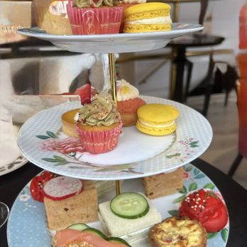 Brigit's Bakery - assorted tea sandwiches and cakes: Strawberry & coconut choux Mango tart Pistachio cupcake Salted orange macaron - Bakeries Near Me - London, XGL