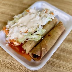 Quesillos Guiliguiste - Taquitos and salad and a splash of house made hot sauce.
