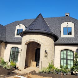 Jenkins Gutter Service - Recent Installation with 6" Dark Bronze Gutters and 3" x 4" Downspouts, and a radius.