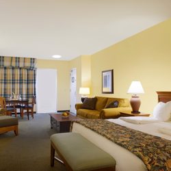 The Landing Hotel - King One Room Mini-Suite, featuring queen sized pull out sofa bed, dining table, balcony with views