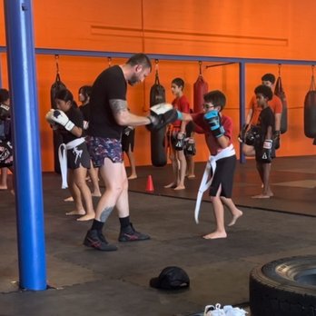 Austin Kickboxing Academy - Working pads with Coach Randy - Boxing Near Me - Austin, Texas Austin Kickboxing Academy - Working pads with Coach Randy - Boxing Near Me - Austin, Texas