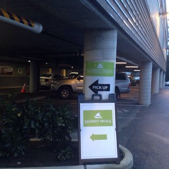 Market Meals - a sign in a parking garage - Mediterranean Near Me - Bainbridge Island, Washington Market Meals - a sign in a parking garage - Mediterranean Near Me - Bainbridge Island, Washington