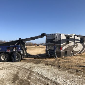 Marion Towing & Repair - Wrecker lifting the rig out of the mud - Towing Near Me - Marion, Arkansas Marion Towing & Repair - Wrecker lifting the rig out of the mud - Towing Near Me - Marion, Arkansas