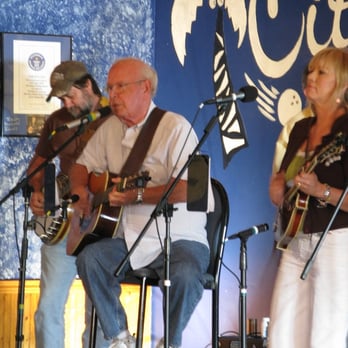City Limits - a group of people playing instruments - Sports Bars Near Me - Melbourne, Florida