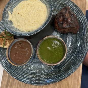 Spurrier's Gridiron Grille - 6oz filet with grits, bourbon pepper and chimichurri sauce - American Near Me - Gainesville, Florida Spurrier's Gridiron Grille - 6oz filet with grits, bourbon pepper and chimichurri sauce - American Near Me - Gainesville, Florida