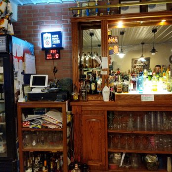 Muddy Run Tavern - a bar with liquor bottles and a television - Burgers Near Me - Huntingdon, Pennsylvania Muddy Run Tavern - a bar with liquor bottles and a television - Burgers Near Me - Huntingdon, Pennsylvania
