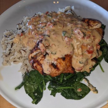 Lovely Day Cafe - Sun Dried Tomato Chicken served on brown and wild rice pilaf with sauteed spinach. - Breakfast & Brunch Near Me - Bedford, Texas