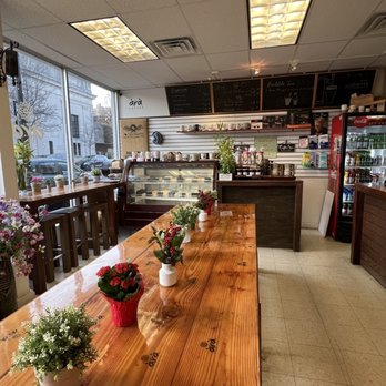 Ara Coffee - a long wooden table in a coffee shop - Coffee Roasteries Near Me - Rutherford, New Jersey