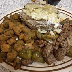 Sirloin tips with peppers and onions. Fried okra and baked potatoes.
