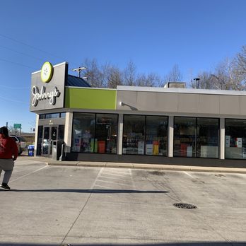 Johnny's Markets - a man walking in front of a store - Convenience Stores Near Me - Battle Creek, Michigan Johnny's Markets - a man walking in front of a store - Convenience Stores Near Me - Battle Creek, Michigan