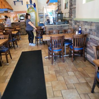 It's Greek To Me - a woman in a restaurant - Greek Near Me - Clifton, New Jersey It's Greek To Me - a woman in a restaurant - Greek Near Me - Clifton, New Jersey