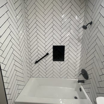 JM Custom Tile and Stone - This is the finished bathroom in heroine bone pattern with new plumbing and a shampoo box - Flooring Near Me - Riverside, California JM Custom Tile and Stone - This is the finished bathroom in heroine bone pattern with new plumbing and a shampoo box - Flooring Near Me - Riverside, California