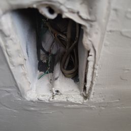 Our home phone lines disconnected by the technician. He left them laying in the bottom of the phone box.