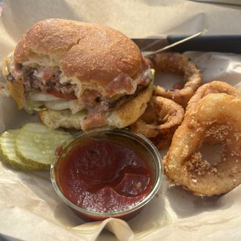 Public Coast Brewing - Burger (gluten free bun) and onion rings (also gf). GF beer not pictured. - American Near Me - Cannon Beach, Oregon Public Coast Brewing - Burger (gluten free bun) and onion rings (also gf). GF beer not pictured. - American Near Me - Cannon Beach, Oregon