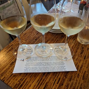 The Grove Wine Bar & Kitchen - Wine flight with the information card - Pizza Near Me - Austin, Texas The Grove Wine Bar & Kitchen - Wine flight with the information card - Pizza Near Me - Austin, Texas