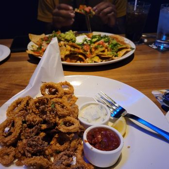 Yard House - Calamari, and chicken nachos. If you can see in the back, there's a bit of an unintentional cheese pull going on - Vegetarian Near Me - Gaithersburg, Maryland Yard House - Calamari, and chicken nachos. If you can see in the back, there's a bit of an unintentional cheese pull going on - Vegetarian Near Me - Gaithersburg, Maryland