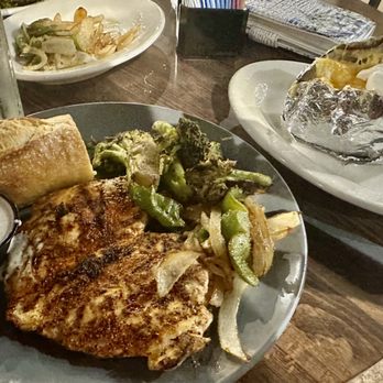 Ro's Grille - Blackened grilled chicken with a baked potato, side of peppers and onions and grilled broccoli - Seafood Near Me - Athens, Alabama Ro's Grille - Blackened grilled chicken with a baked potato, side of peppers and onions and grilled broccoli - Seafood Near Me - Athens, Alabama