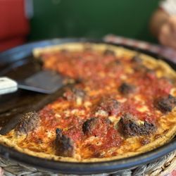 Mr Gilberti's Place Chicago Pizza - The large deep dish pizza with meatballs as a topping