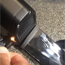 Sparks fly from battery.
