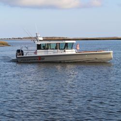 5 More Minutes Charters - Enjoy comfortable seating in our enclosed cabin or on the front of the boat.