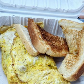 Village Green Restaurant - Cheese omelet with toast corn beef hash is under the omelet. My Sister ordered - Breakfast & Brunch Near Me - Gaithersburg, Maryland