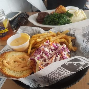 Bungalow Bar - Fish sandwich. Steak lobster mash (far plate) - American Near Me - Seaside, New York