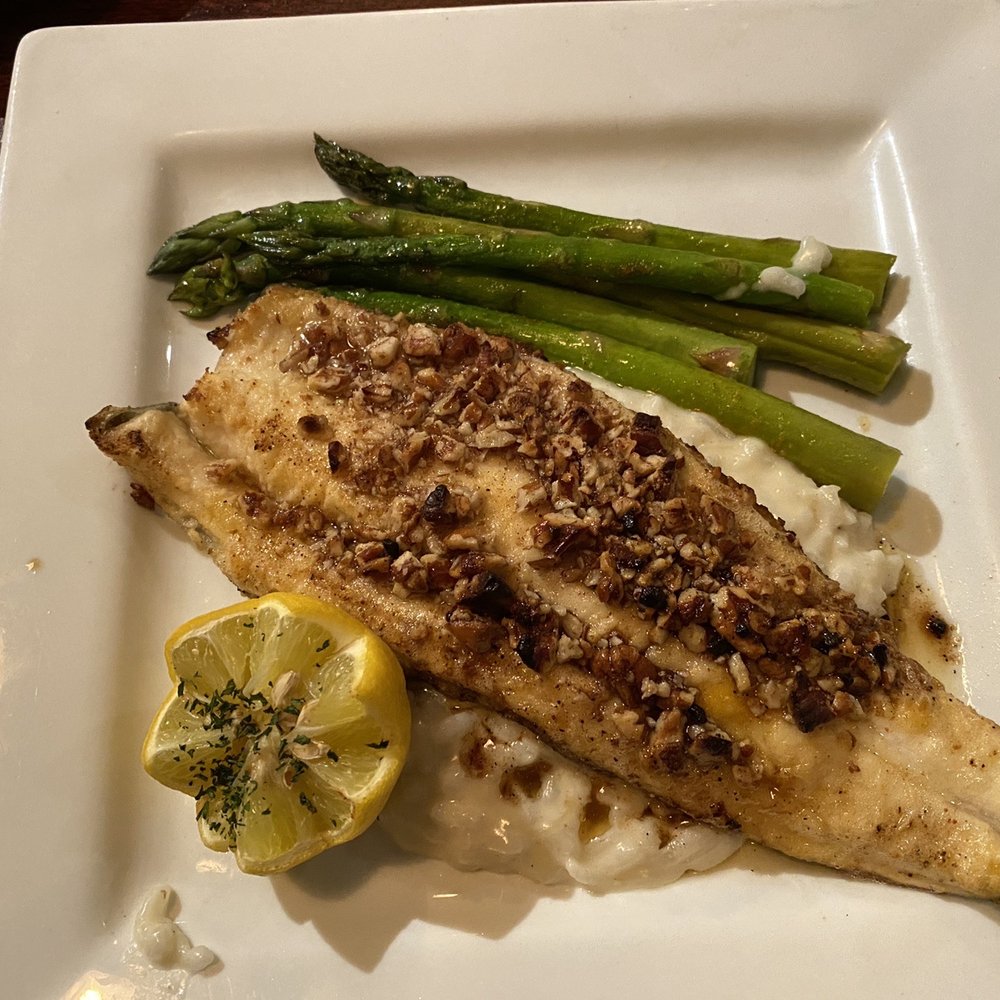 Gages Steak House - Pecan crusted rainbow trout over a bed of risotto and asparagus. - Steakhouses Near Me - Guthrie, Oklahoma Gages Steak House - Pecan crusted rainbow trout over a bed of risotto and asparagus. - Steakhouses Near Me - Guthrie, Oklahoma