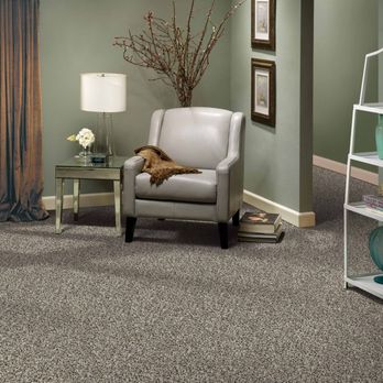 Floormax - a living room with a chair and a bookcase - Flooring Near Me - Elkridge, Maryland Floormax - a living room with a chair and a bookcase - Flooring Near Me - Elkridge, Maryland