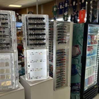 Eddies Market - Showcases with jewelry, watches, and accessories are arranged inside a retail store, with various items visible through transparent cases. - Grocery Near Me - Albuquerque, New Mexico