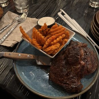The Cedar Room - Special Cut Ribeye with sweet potato fries - Steakhouses Near Me - North Platte, Nebraska