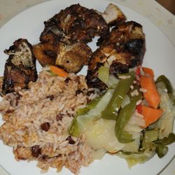 Jamaican Gates Restaurant - Jerk catfish dinner w/cabbage & red beans and rice.