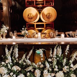 Head table with ceremony florals repurposed