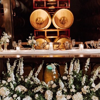 Delford West Flowers - Head table with ceremony florals repurposed - Florists Near Me