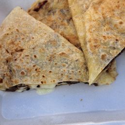 quesadillas in a styrofoam container quesadillas in a styrofoam container
