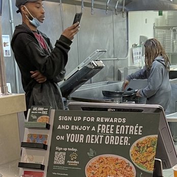 Noodles and Company - Manager, DeMarcus, on his phone and the guy preparing the food has long hair in dreadlocks that is not pulled back. - Noodles Near Me - Milwaukee, Wisconsin Noodles and Company - Manager, DeMarcus, on his phone and the guy preparing the food has long hair in dreadlocks that is not pulled back. - Noodles Near Me - Milwaukee, Wisconsin