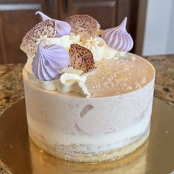 Gelato & Co - An elegant gelato cake layered with taro, coconut, on a vanilla base. Light, creamy, and thoughtfully balanced.