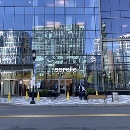 the reflection of a building in the glass