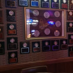 Rooters Bar - Rooters volleyball wall! My name is on a couple of these plaques!