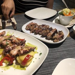 Los Caracoles - Grilled squid with boiled potatoes and pork ribeye. So yummy!!!