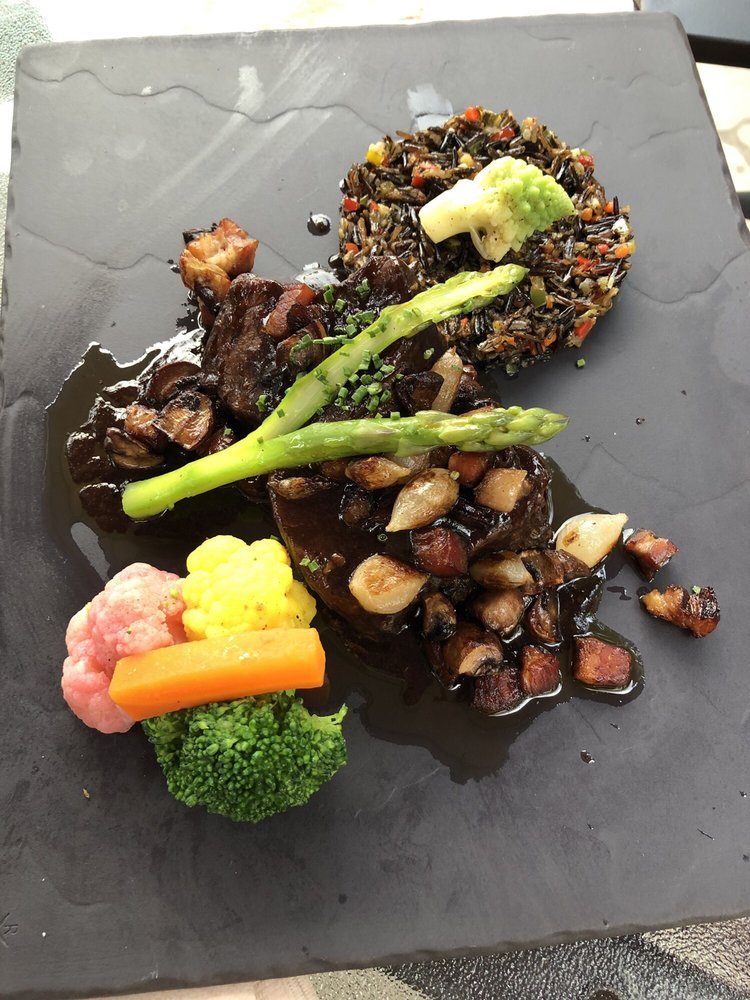 Woodstone Restaurant & Patio Logo