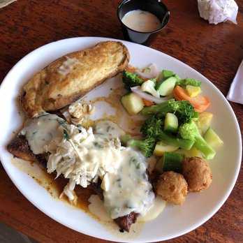 Pompano Joe's - Grouper Guadeloupe with basil cream sauce, Twice - baked Potato, and veggies - Seafood Near Me - Destin, Florida