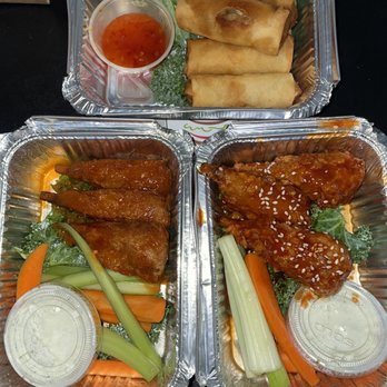 Plant Blossom - two trays of chicken wings, carrots, celery, and dipping sauce - Vegetarian Near Me - New York, New York Plant Blossom - two trays of chicken wings, carrots, celery, and dipping sauce - Vegetarian Near Me - New York, New York