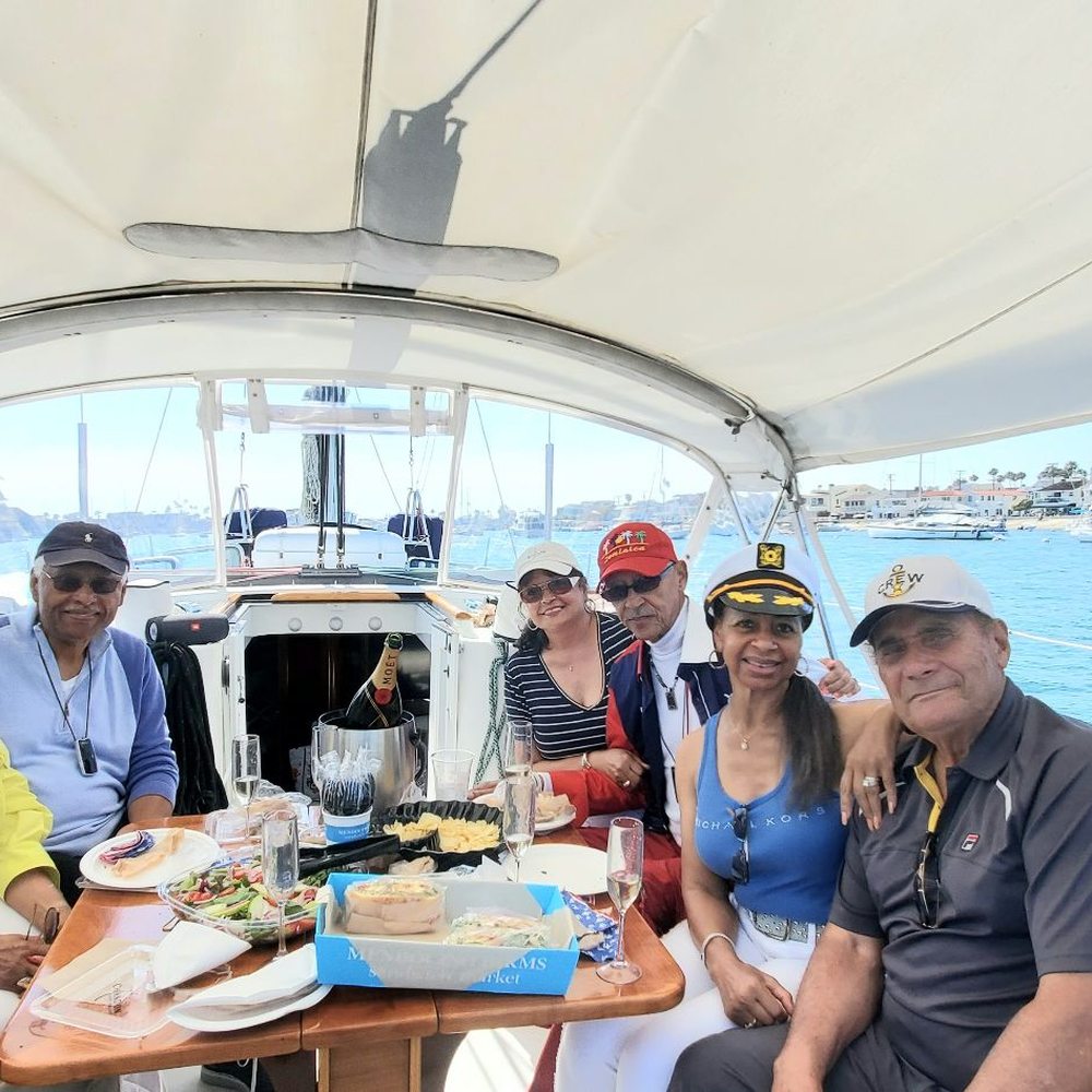 Captain Frank's Sailing Adventures - The group enjoying a birthday cruise. - Boat Charters Near Me Captain Frank's Sailing Adventures - The group enjoying a birthday cruise. - Boat Charters Near Me