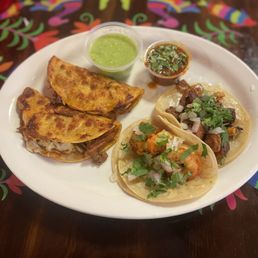 Birria, shrimp and pastor tacos