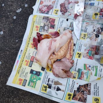 Santa Rosa Seafood - a piece of meat on a newspaper - Seafood Markets Near Me - Santa Rosa, California