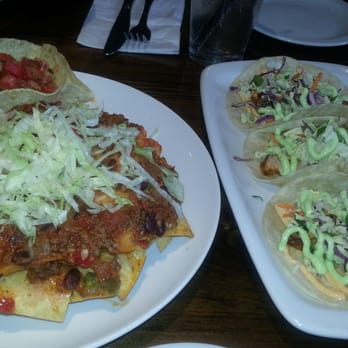Union Social Eatery - Nachitos $13.95 with braised brisket chili $3 and grilled swordfish tacos $11.87 - American Near Me - Toronto, Ontario