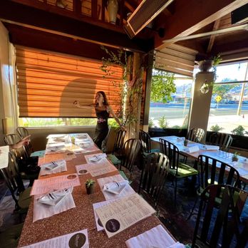 Divina Cucina - Patio seating - they did a good job keeping it cool even in the summer heat with misting fans and ceiling fans! - Italian Near Me - Montrose, California Divina Cucina - Patio seating - they did a good job keeping it cool even in the summer heat with misting fans and ceiling fans! - Italian Near Me - Montrose, California