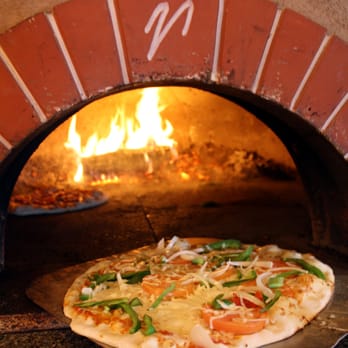 Fireside Flatbread - a pizza cooking in a brick oven - Pizza Near Me - Bolton, Vermont Fireside Flatbread - a pizza cooking in a brick oven - Pizza Near Me - Bolton, Vermont